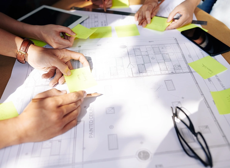 Group planning with sticky notes and glasses