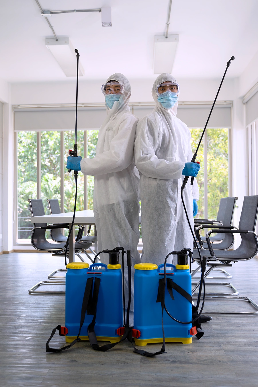 Disinfection team with protective gear indoors