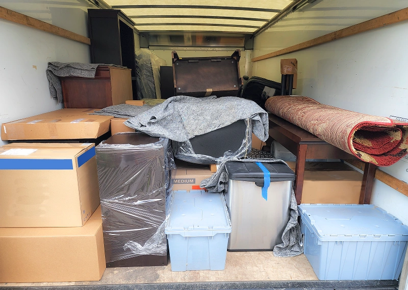 Moving truck filled with packed boxes